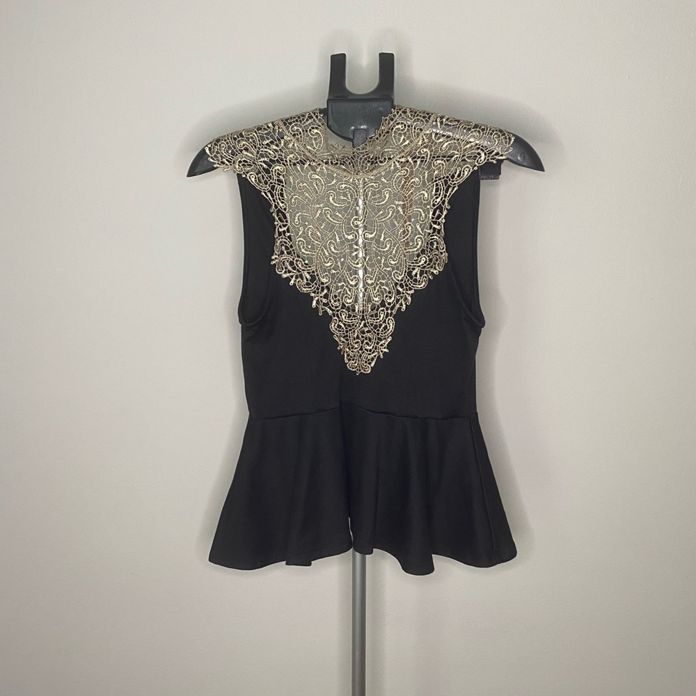 Unique black and gold blouse with beautiful details open back with bow. Medium